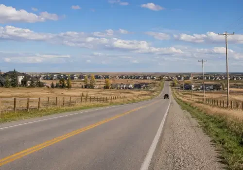 Vehicle being transported by tow truck in Langdon, Alberta