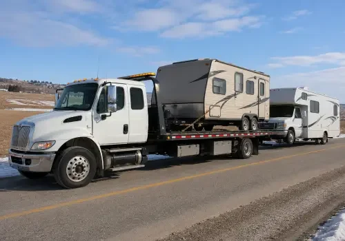 Tow truck transporting a trailer or motorhome in Calgary